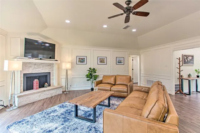 a living room with furniture and a fireplace