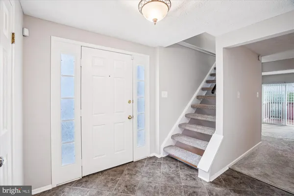 a view of entryway with stairs