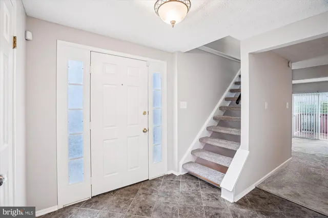 a view of entryway with stairs