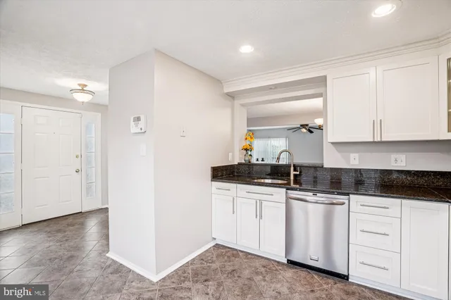 a kitchen with white cabinets