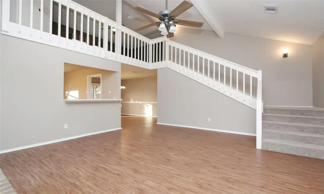 a view of an entryway with wooden floor
