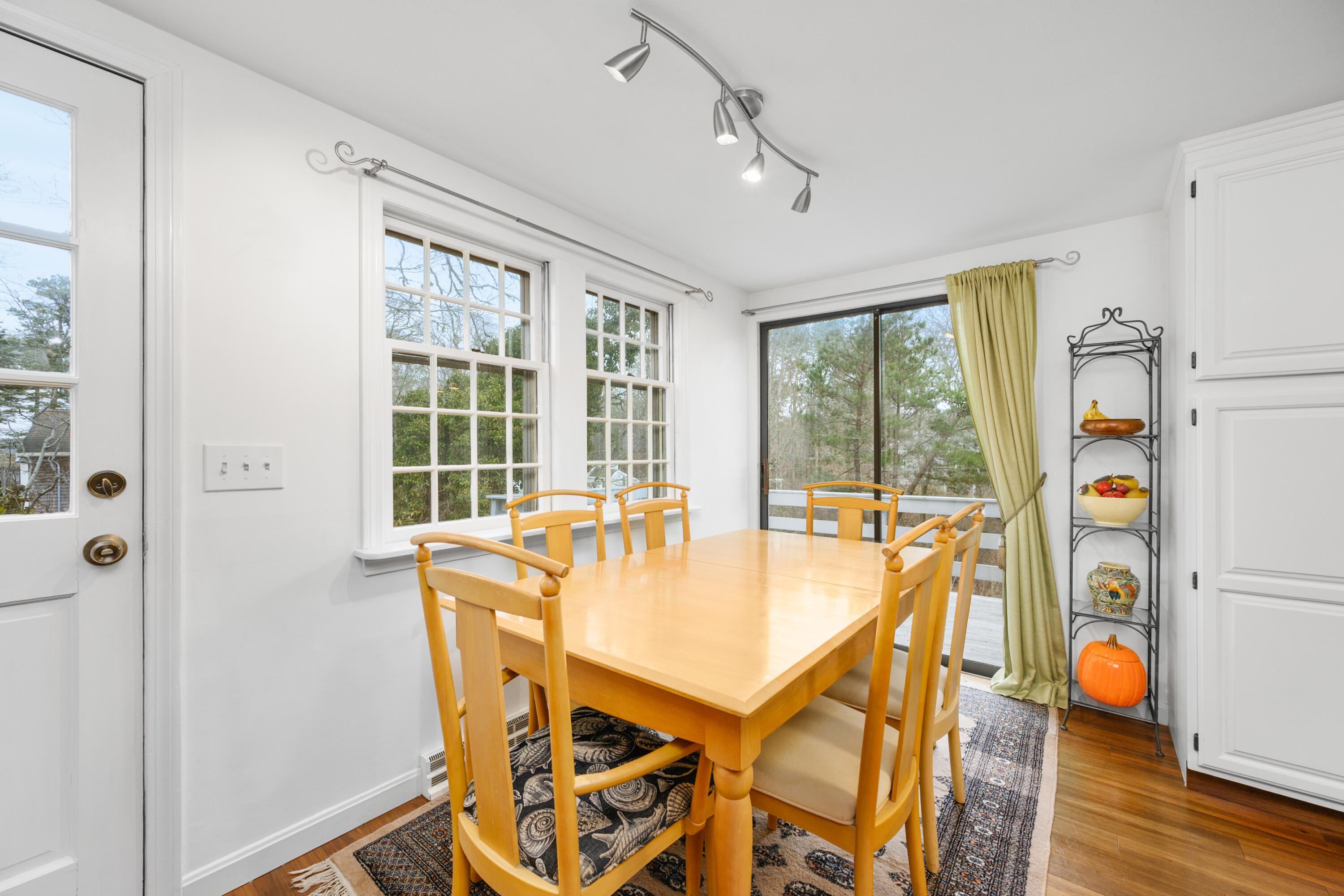 1157 Orleans-Harwich Road Harwich, MA 02645 - Photo 12 of 41 a view of a dining room with furniture and wooden floor