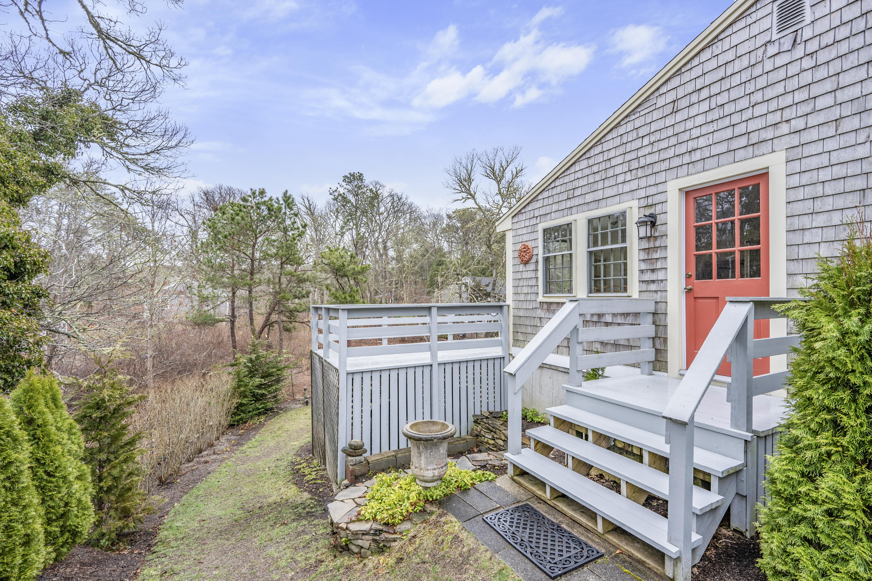 1157 Orleans-Harwich Road Harwich, MA 02645 - Photo 14 of 41 a view of a chair and table in the backyard