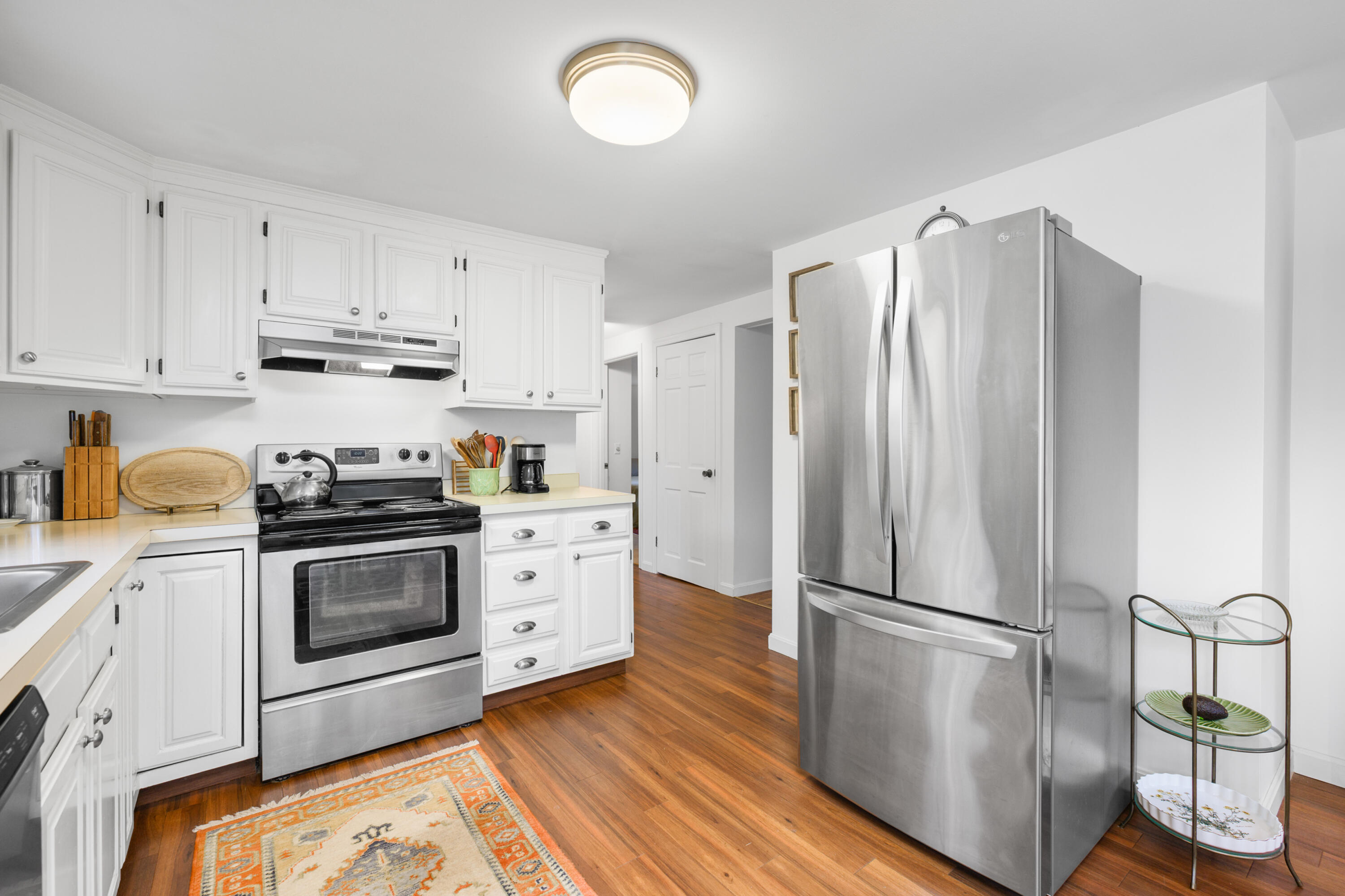 1157 Orleans-Harwich Road Harwich, MA 02645 - Photo 10 of 41 a kitchen with stainless steel appliances a refrigerator sink and cabinets
