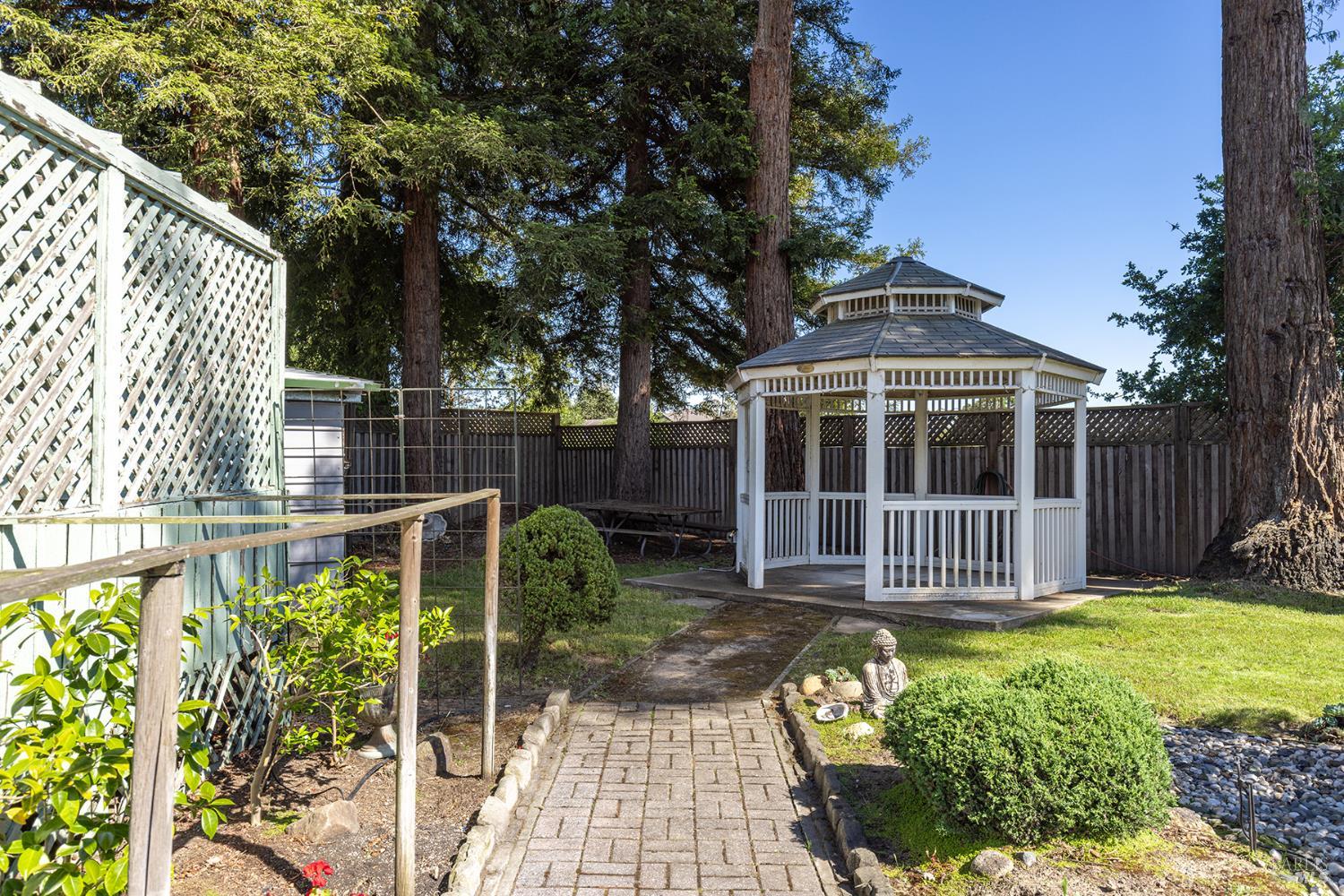 2236 West Hearn Avenue Santa Rosa, CA 95407 - Photo 46 of 56 a view of a house with a small yard and wooden fence