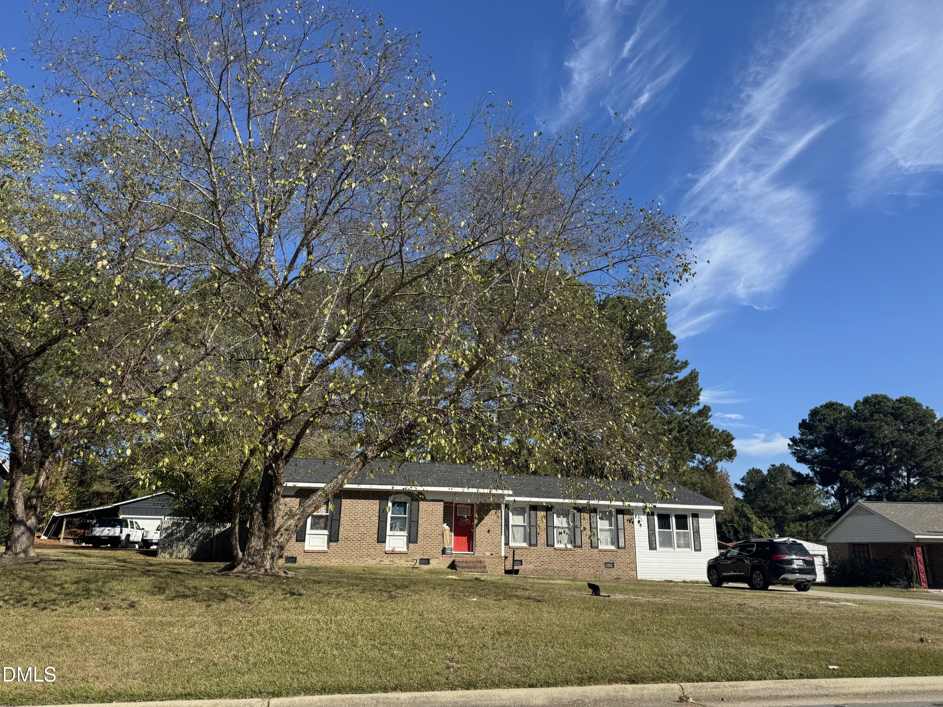2720 Buff Road Rocky Mount, NC 27803 - Photo 2 of 8 a front view of a house with a garden