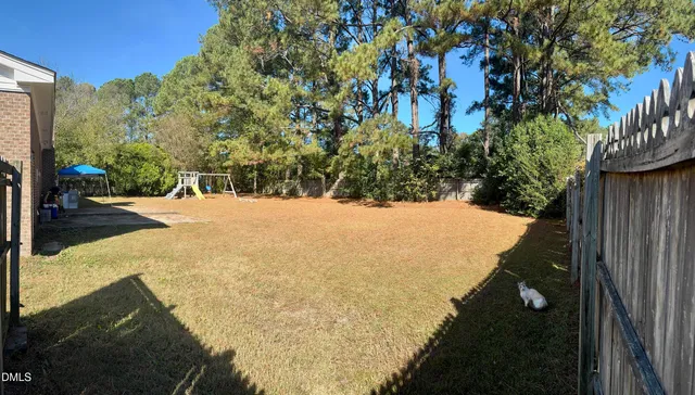 a view of a backyard of the house