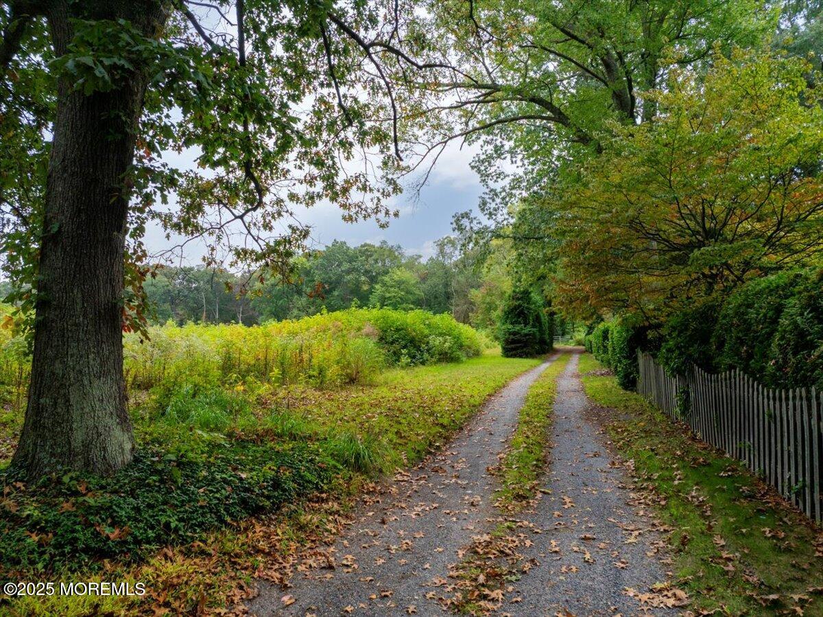 271 Cranberry Road Farmingdale, NJ 07727 - Photo 3 of 3 a view of a yard with large trees