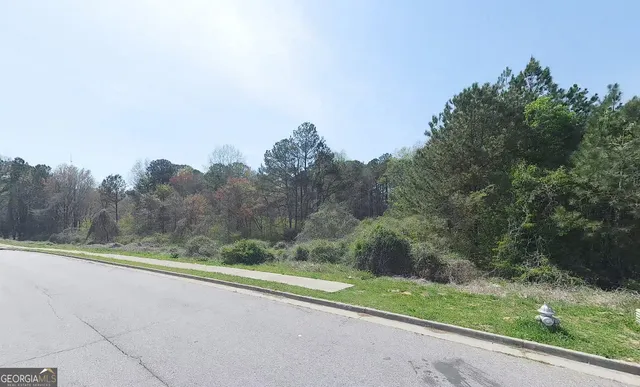 a view of a yard with an trees