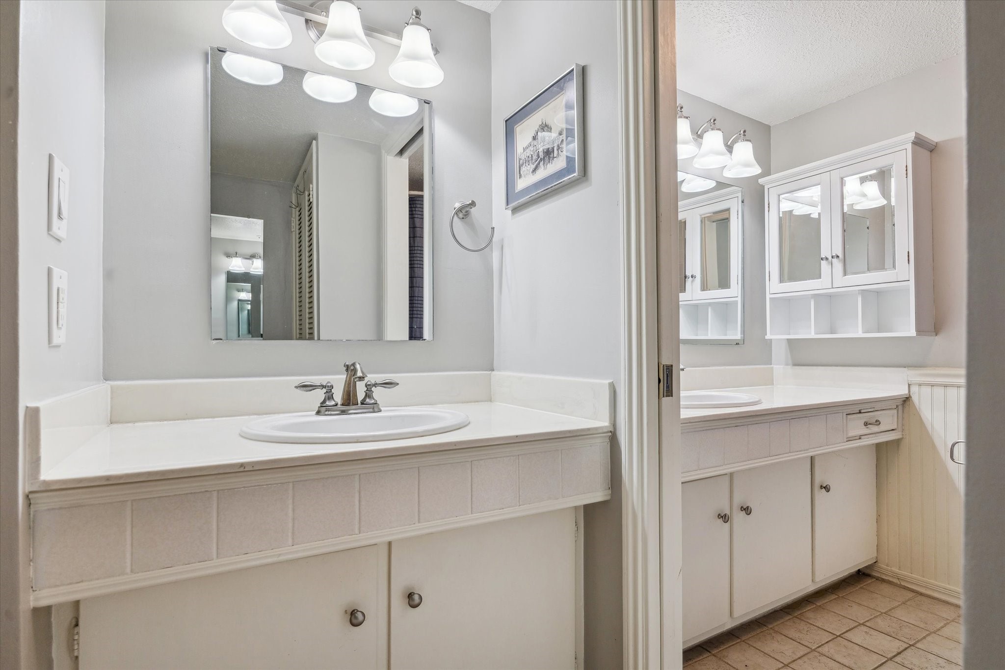 6465 Bayou Glen Road Houston, TX 77057 - Photo 11 of 15 a bathroom with a sink vanity and a mirror