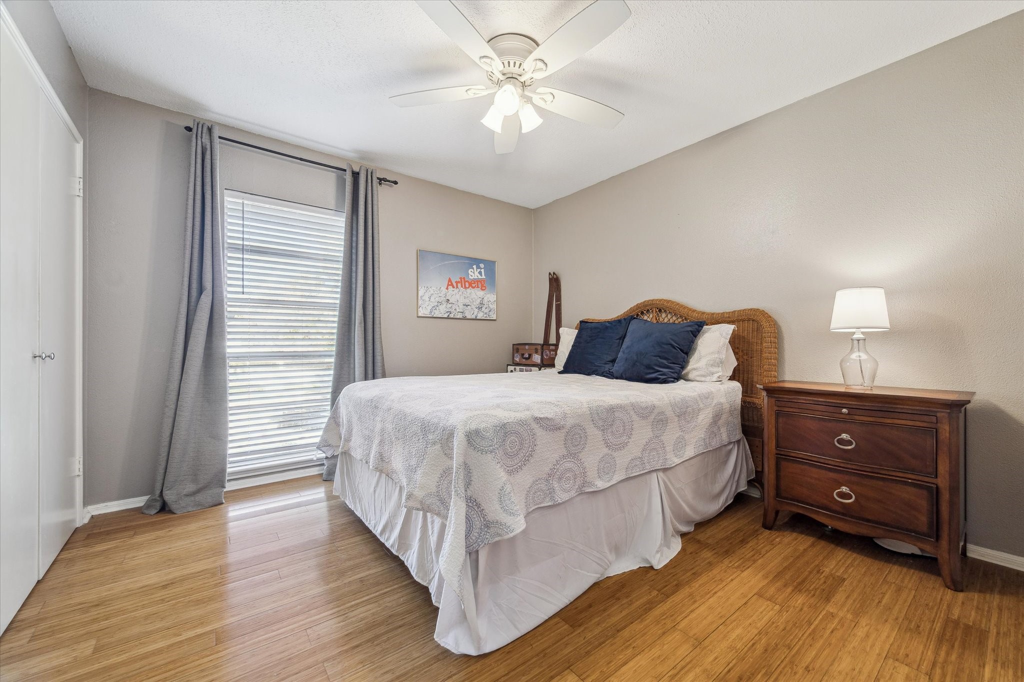 6465 Bayou Glen Road Houston, TX 77057 - Photo 12 of 15 a bedroom with a bed and a chandelier