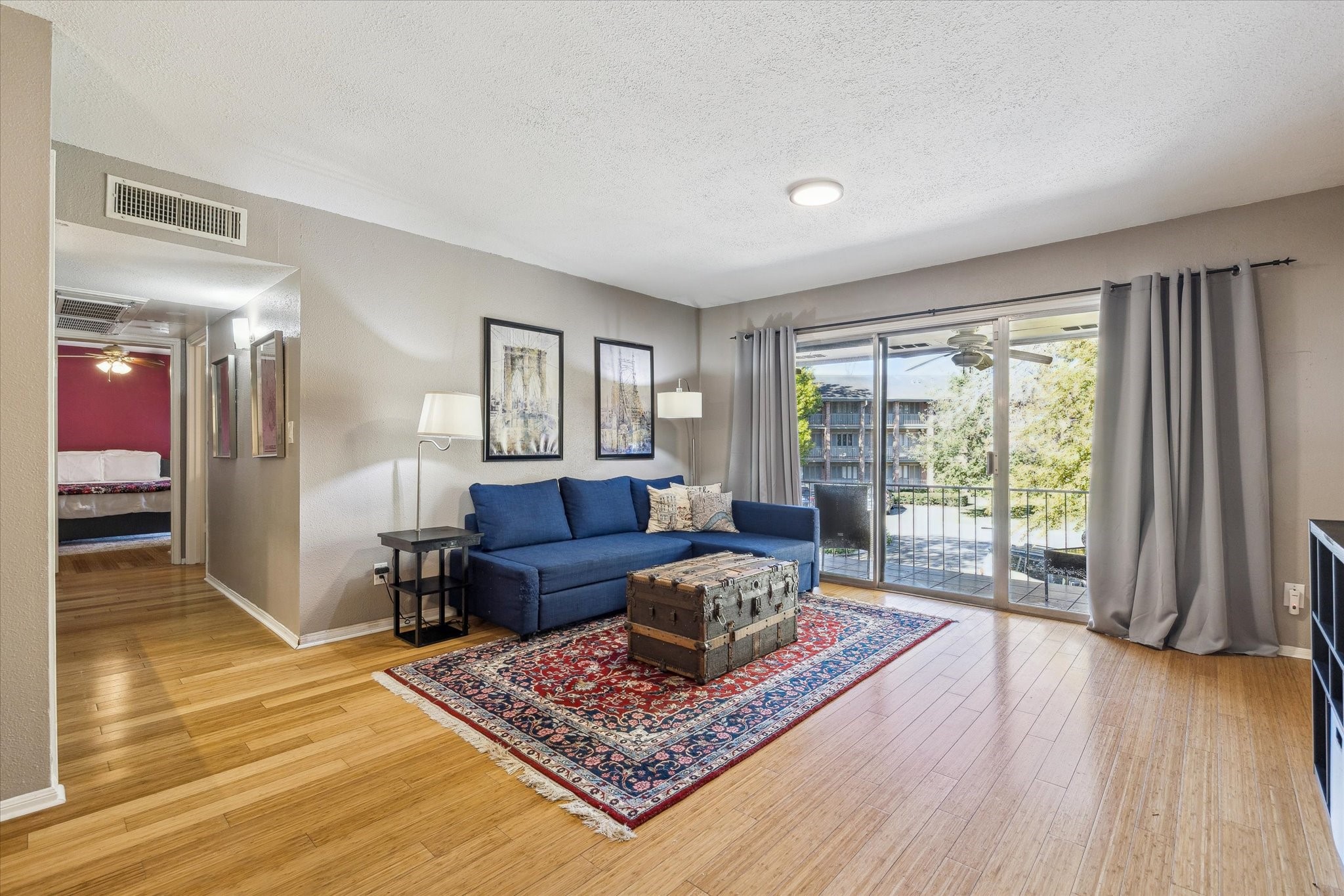 6465 Bayou Glen Road Houston, TX 77057 - Photo 2 of 15 a living room with furniture and a wooden floor