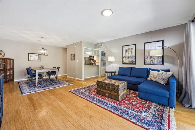 a living room with furniture and a rug