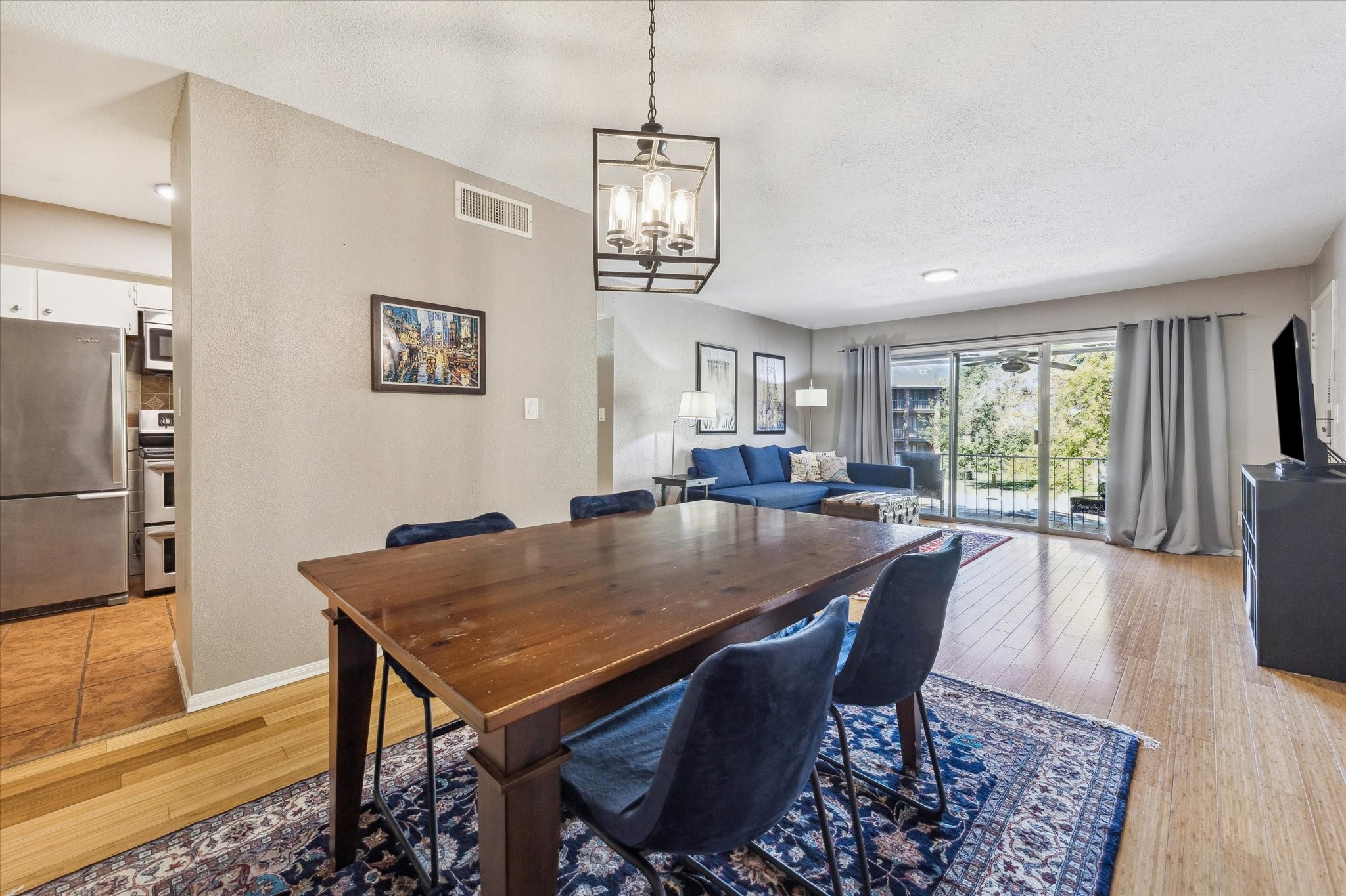 6465 Bayou Glen Road Houston, TX 77057 - Photo 4 of 15 a view of a dining room with furniture window and wooden floor