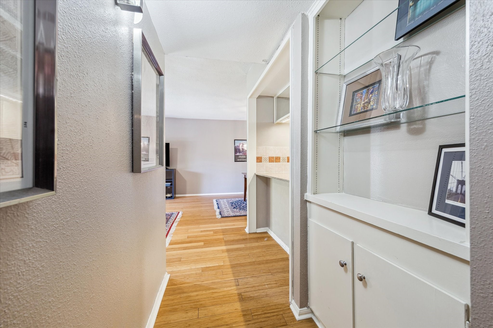 6465 Bayou Glen Road Houston, TX 77057 - Photo 7 of 15 a hallway with cabinets