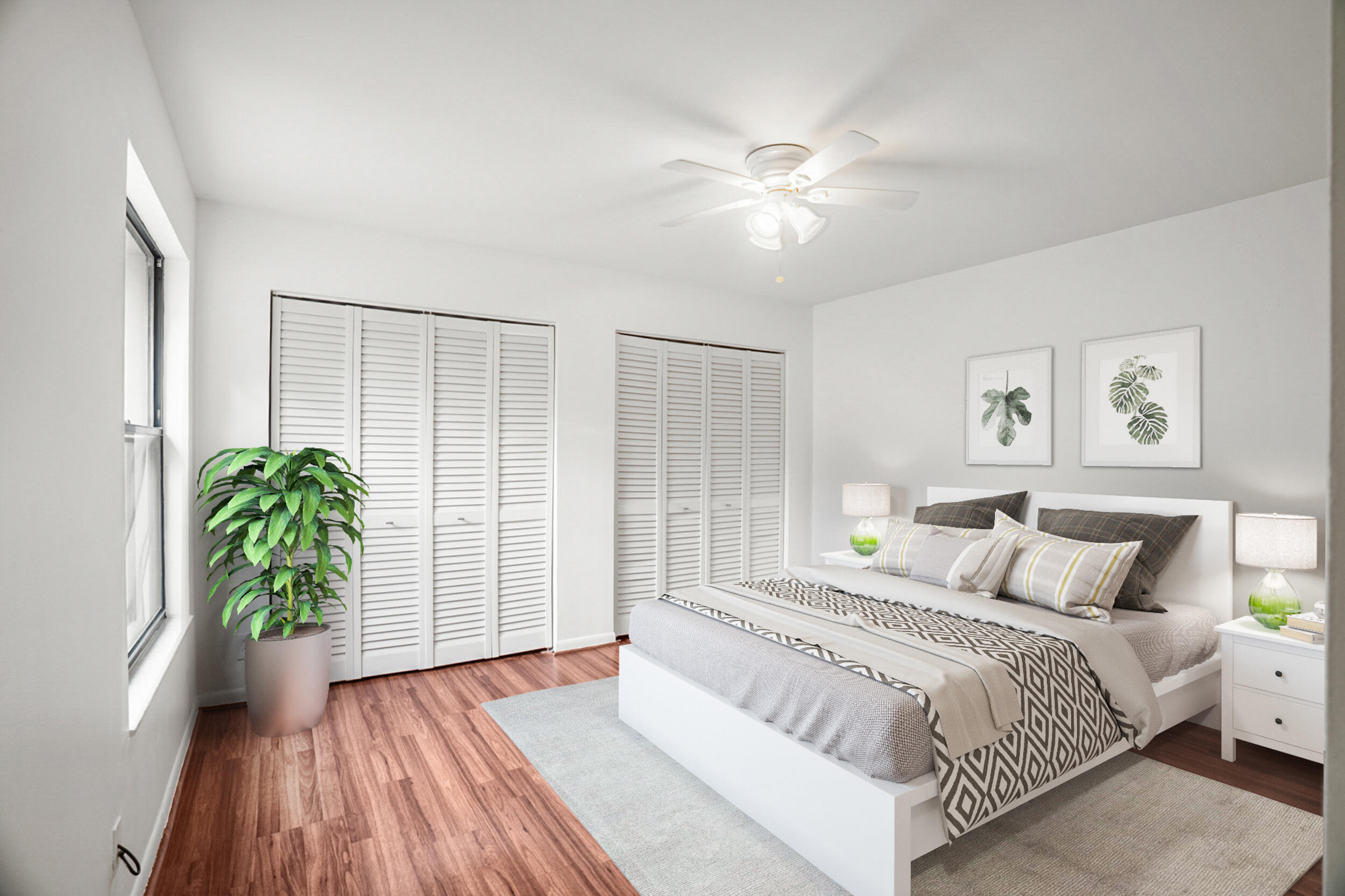 7690 Courtyard Run West Boca Raton, FL 33433 - Photo 11 of 22 a bedroom with a large bed and a potted plant