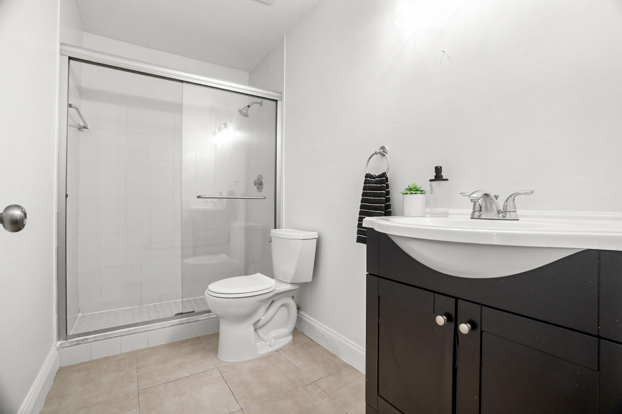 7690 Courtyard Run West Boca Raton, FL 33433 - Photo 13 of 22 a bathroom with a sink toilet and a mirror