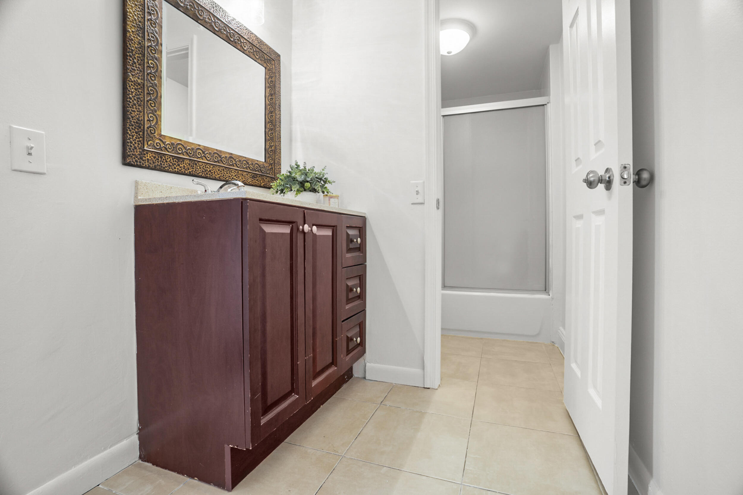 7690 Courtyard Run West Boca Raton, FL 33433 - Photo 16 of 22 a view of a hallway with wooden floor and entryway