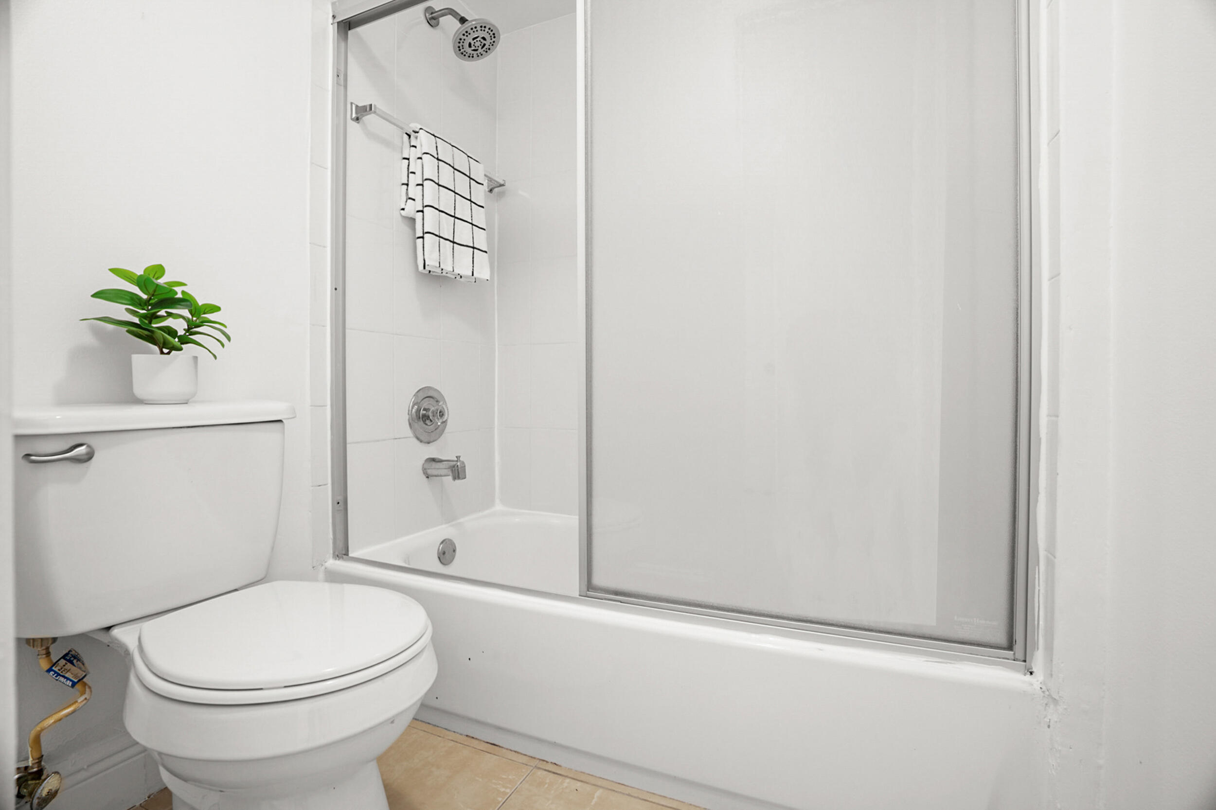 7690 Courtyard Run West Boca Raton, FL 33433 - Photo 17 of 22 a bathroom with a toilet and a shower