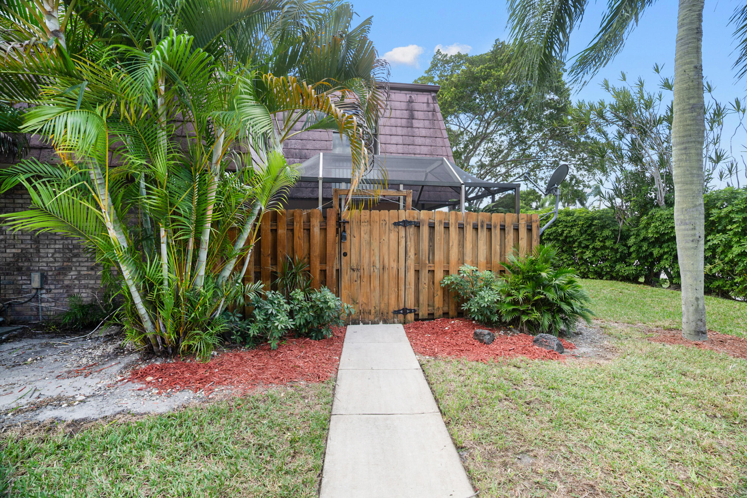 7690 Courtyard Run West Boca Raton, FL 33433 - Photo 4 of 22 a view of a pathway with a house