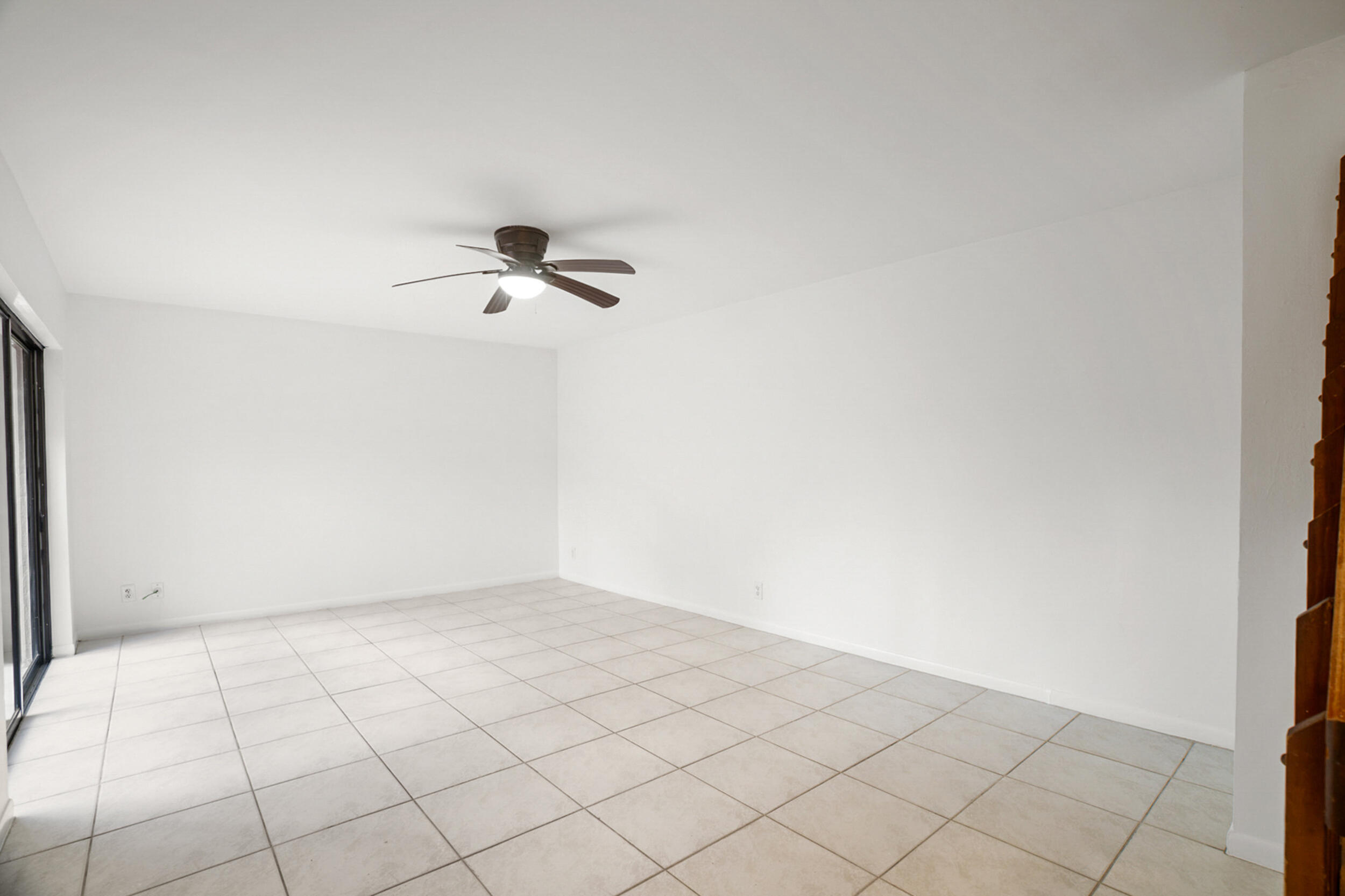 7690 Courtyard Run West Boca Raton, FL 33433 - Photo 6 of 22 a view of a room with wooden floor
