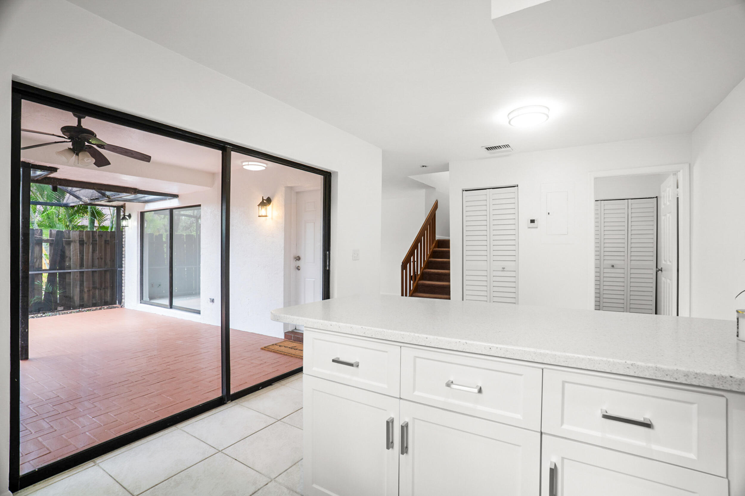 7690 Courtyard Run West Boca Raton, FL 33433 - Photo 8 of 22 a bedroom with a bed a mirror and window
