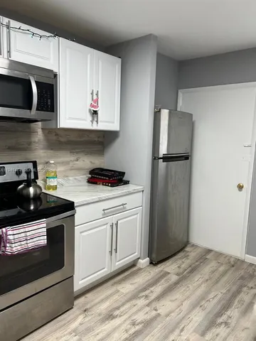 a kitchen with a stove and a microwave