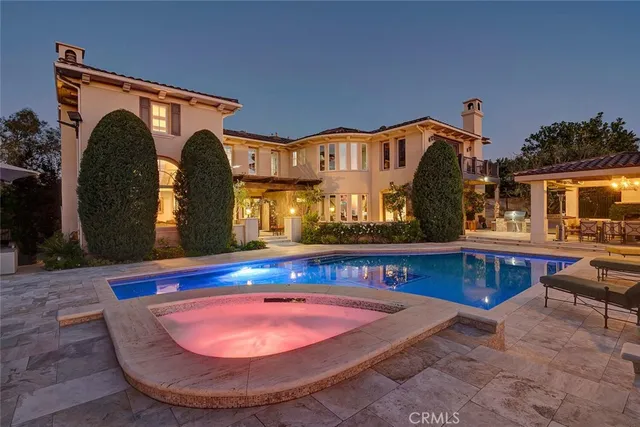 a living room with furniture a fireplace and a large window