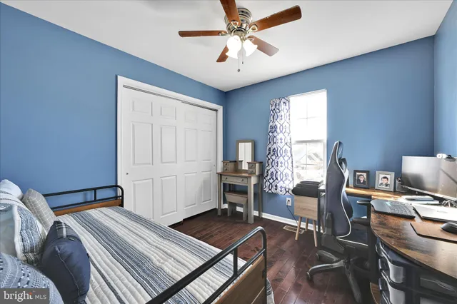 a bedroom with furniture and a window