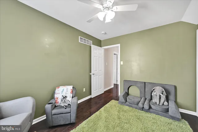 a bedroom with furniture and a chandelier