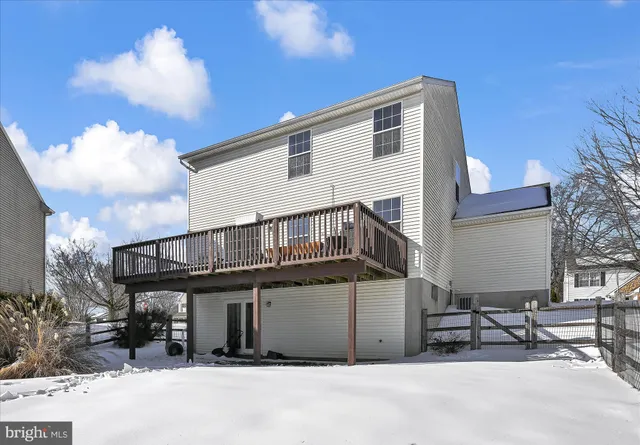 a balcony with a table and chairs