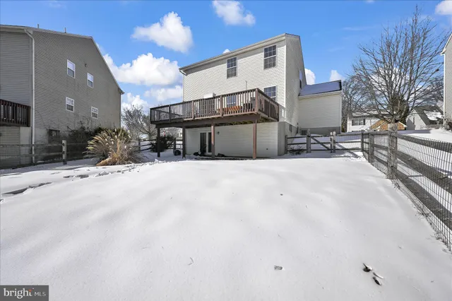 a view of a house with a snow in a yard