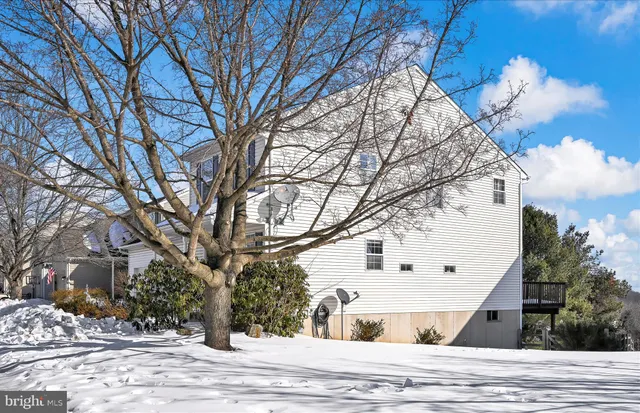 a view of a white house with a snow