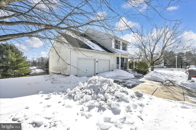 a view of a yard covered in snow