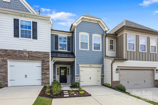 a front view of a house with a garage