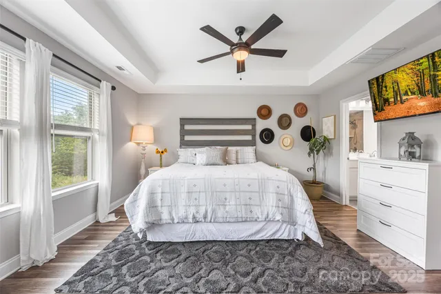 a bedroom with a bed and a tv