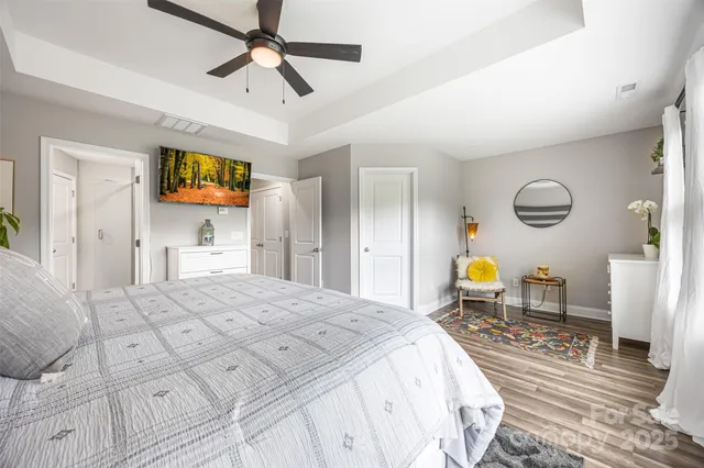 a bedroom with a bed a table and chair