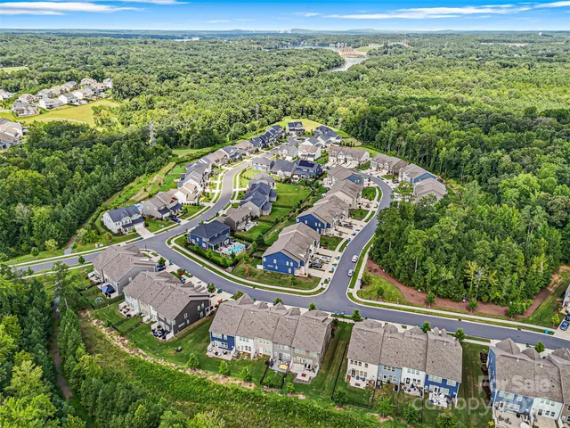 a aerial view of a house with table and chairs