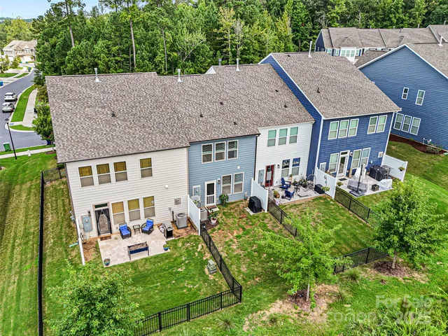 a view of an house with backyard porch and furniture