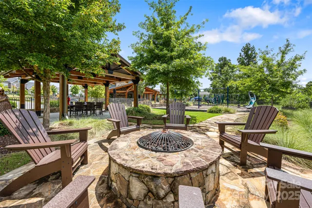 an aerial view of a house with swimming pool and patio
