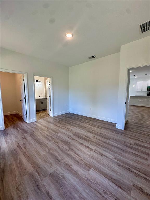 1840 Greenley Road North Port, FL 34286 - Photo 18 of 24 a view of empty room with wooden floor