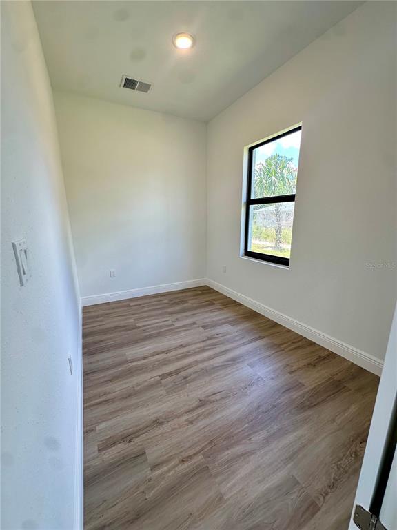 1840 Greenley Road North Port, FL 34286 - Photo 21 of 24 an empty room with a window