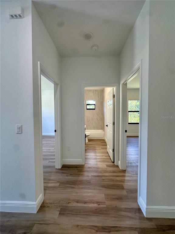 1840 Greenley Road North Port, FL 34286 - Photo 7 of 24 a view of a hallway with wooden floor