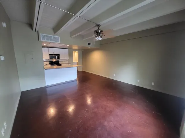 a view of a kitchen with a sink and a stove top oven