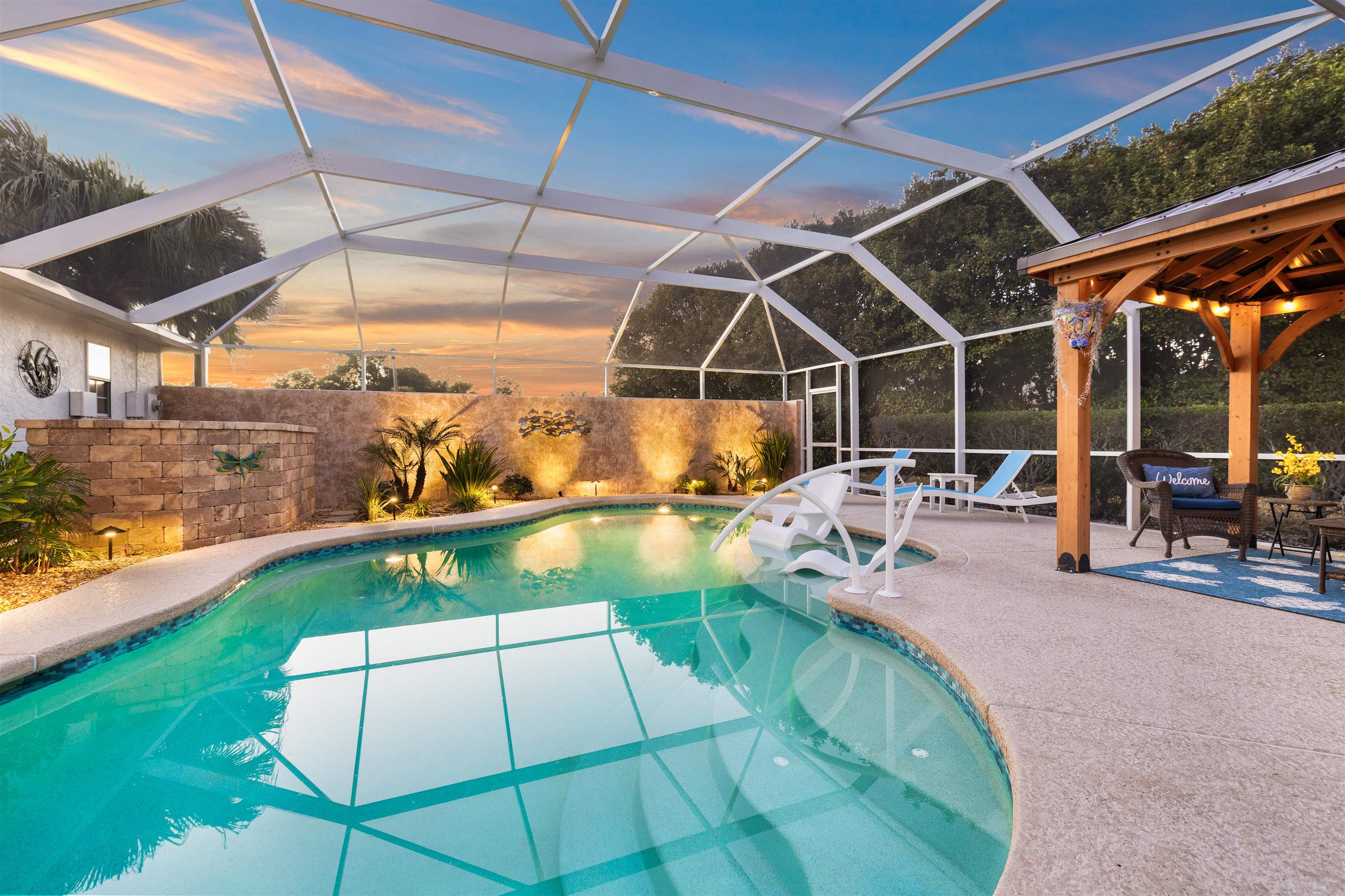655 East Bianca Circle St. Augustine, FL 32086 - Photo 16 of 53 a view of a swimming pool with a patio and a yard