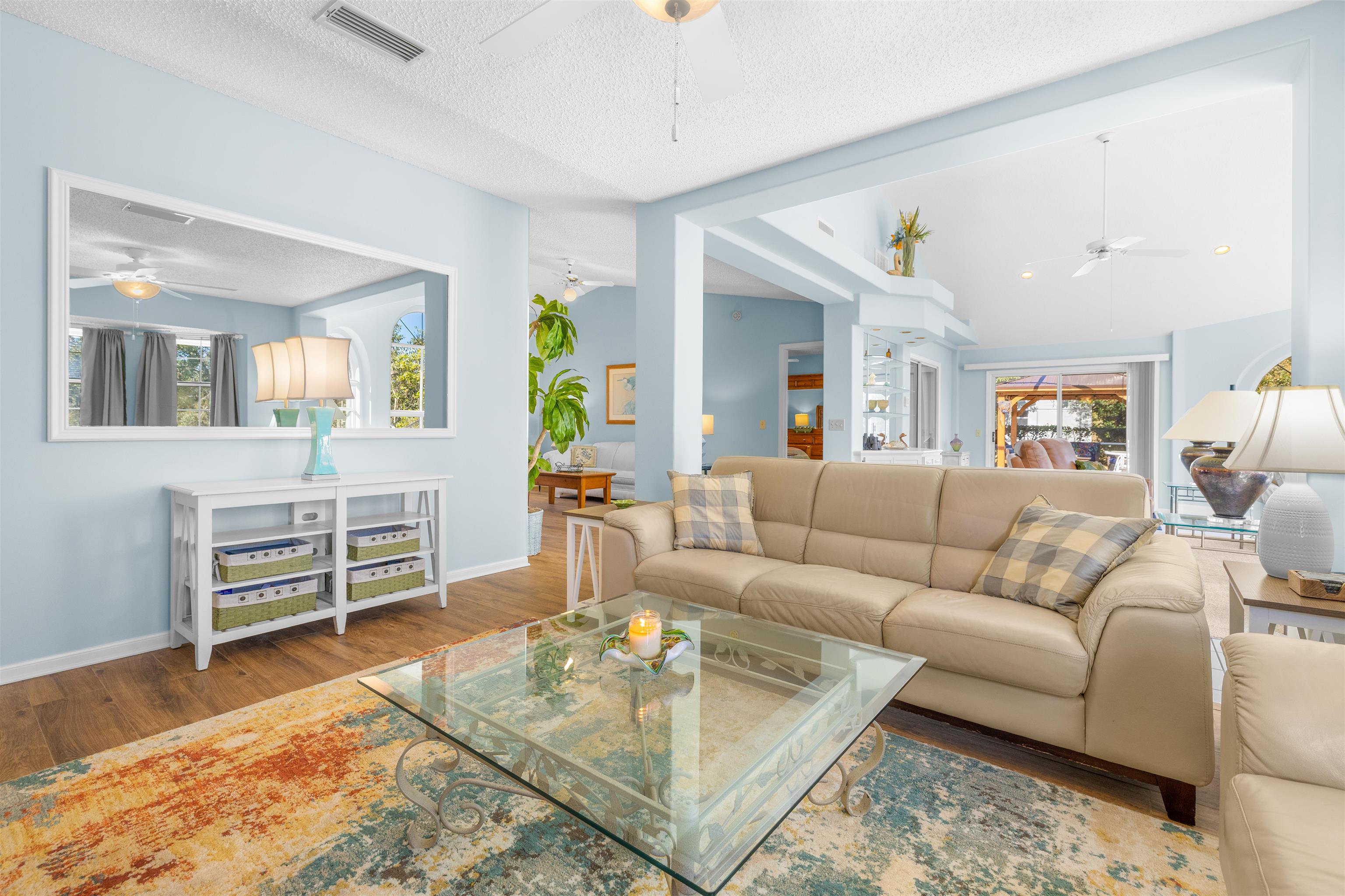 655 East Bianca Circle St. Augustine, FL 32086 - Photo 17 of 53 a living room with furniture a flat screen tv and wooden floor