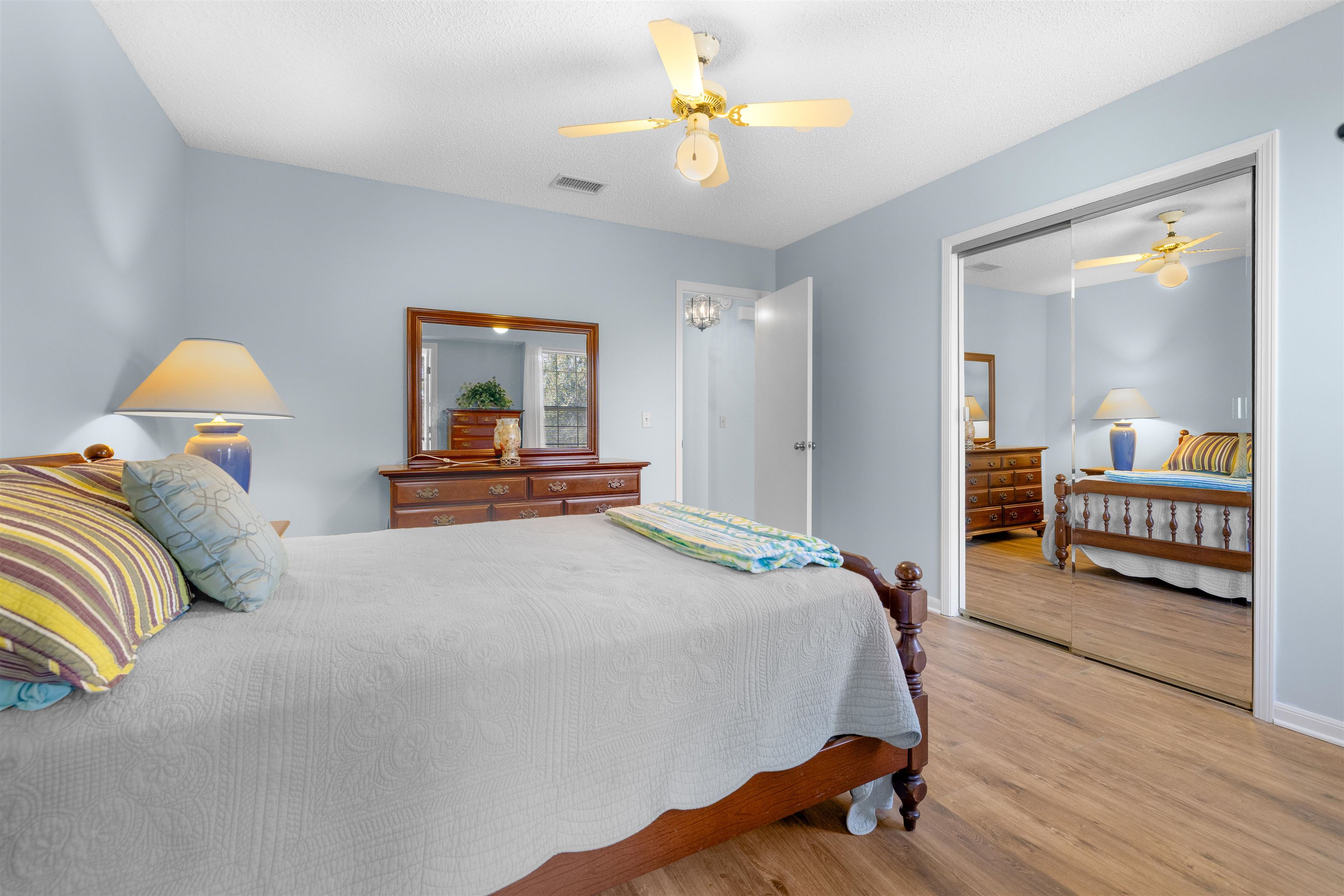 655 East Bianca Circle St. Augustine, FL 32086 - Photo 19 of 53 a bedroom with a bed and a chandelier