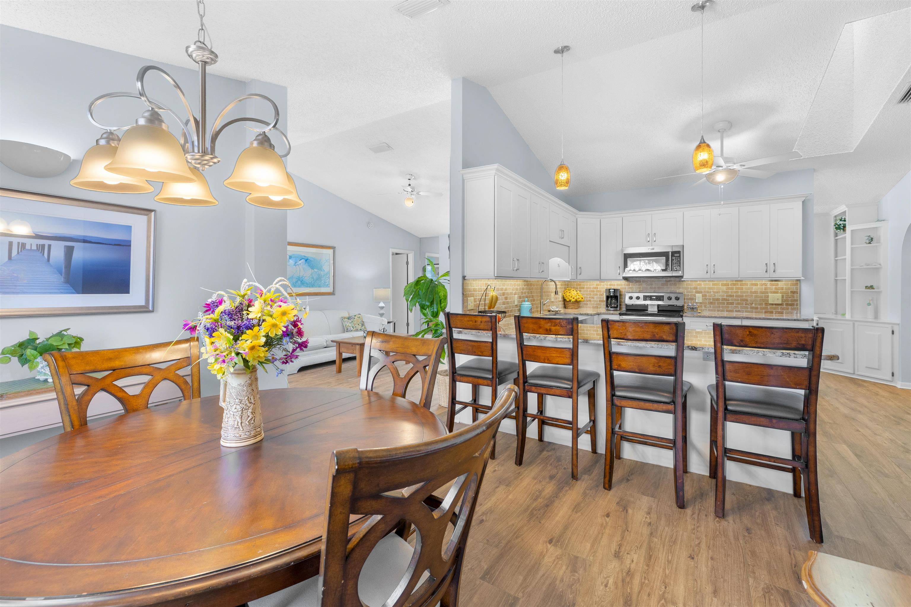 655 East Bianca Circle St. Augustine, FL 32086 - Photo 25 of 53 a view of a dining room with furniture and wooden floor