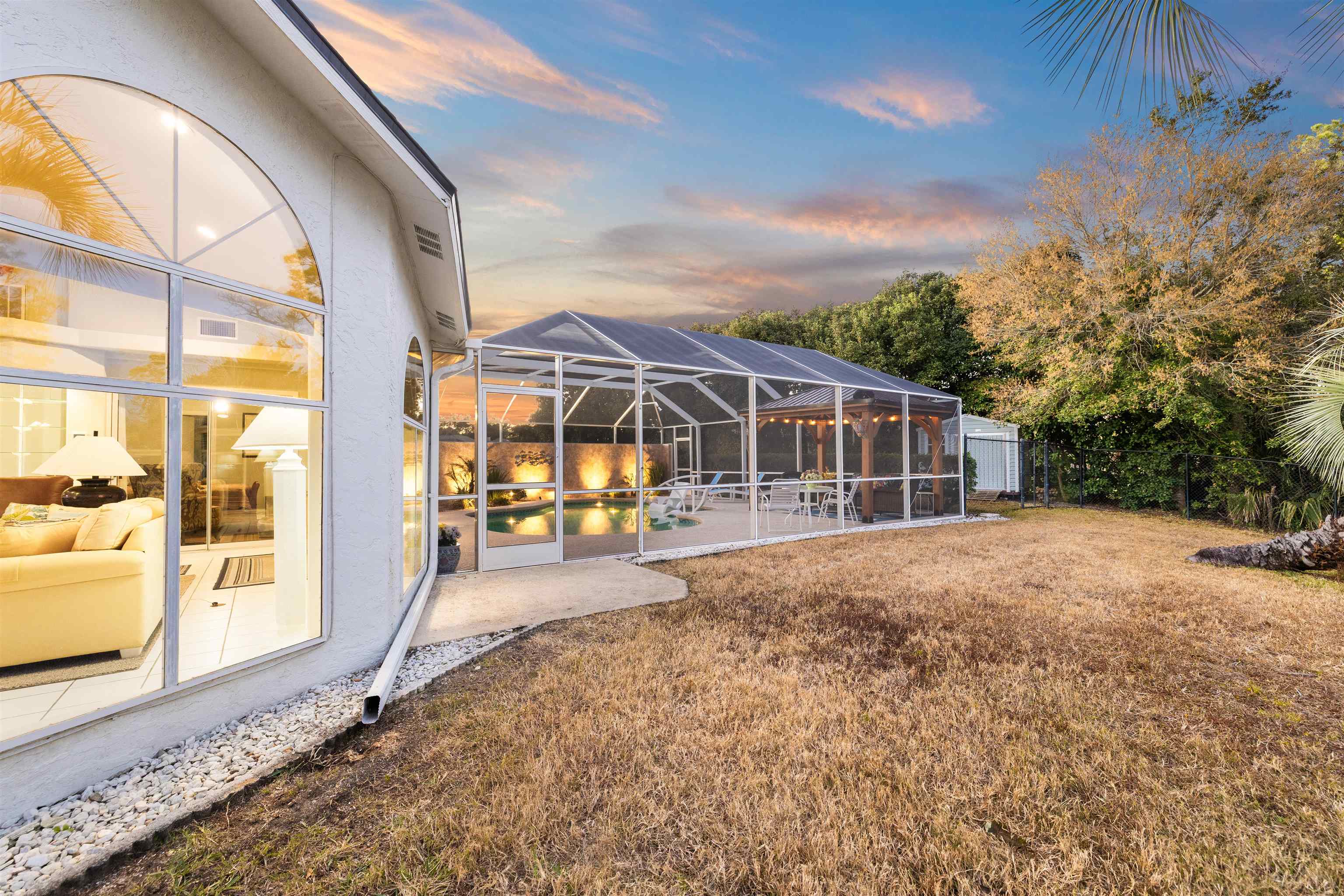 655 East Bianca Circle St. Augustine, FL 32086 - Photo 36 of 53 a house with trees in the background