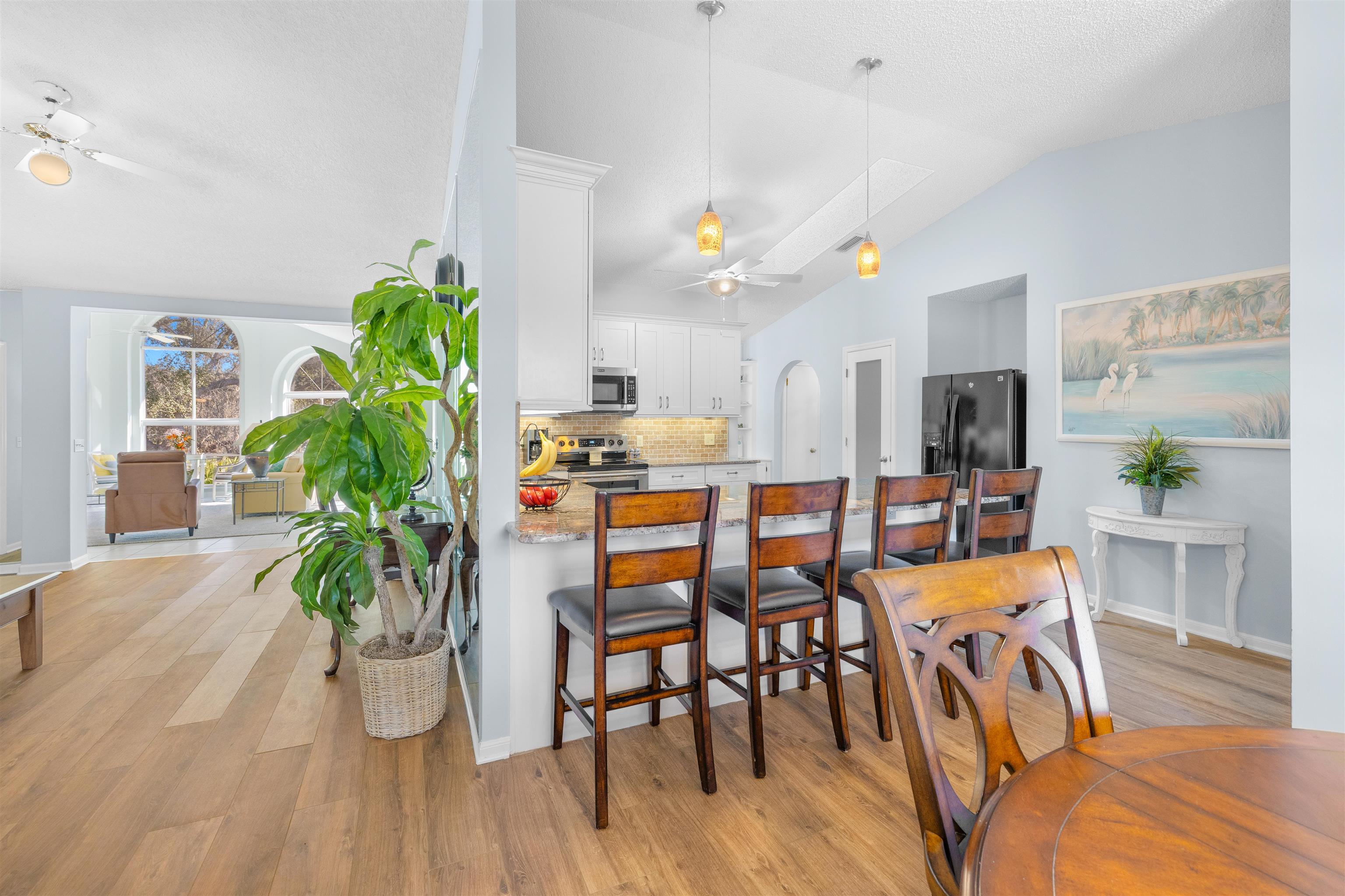 655 East Bianca Circle St. Augustine, FL 32086 - Photo 10 of 53 a view of a dining room with furniture and a potted plant